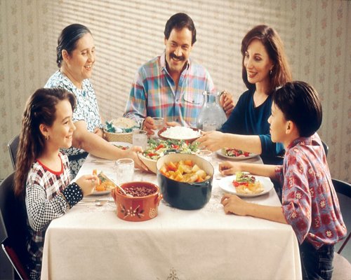 Calm family dinner at home with warm atmosphere